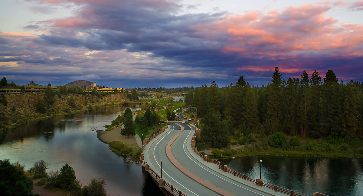 Bridge over a river at sunrise.