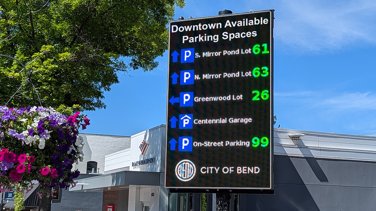 Sign indicating available parking spaces in Downtown Bend.