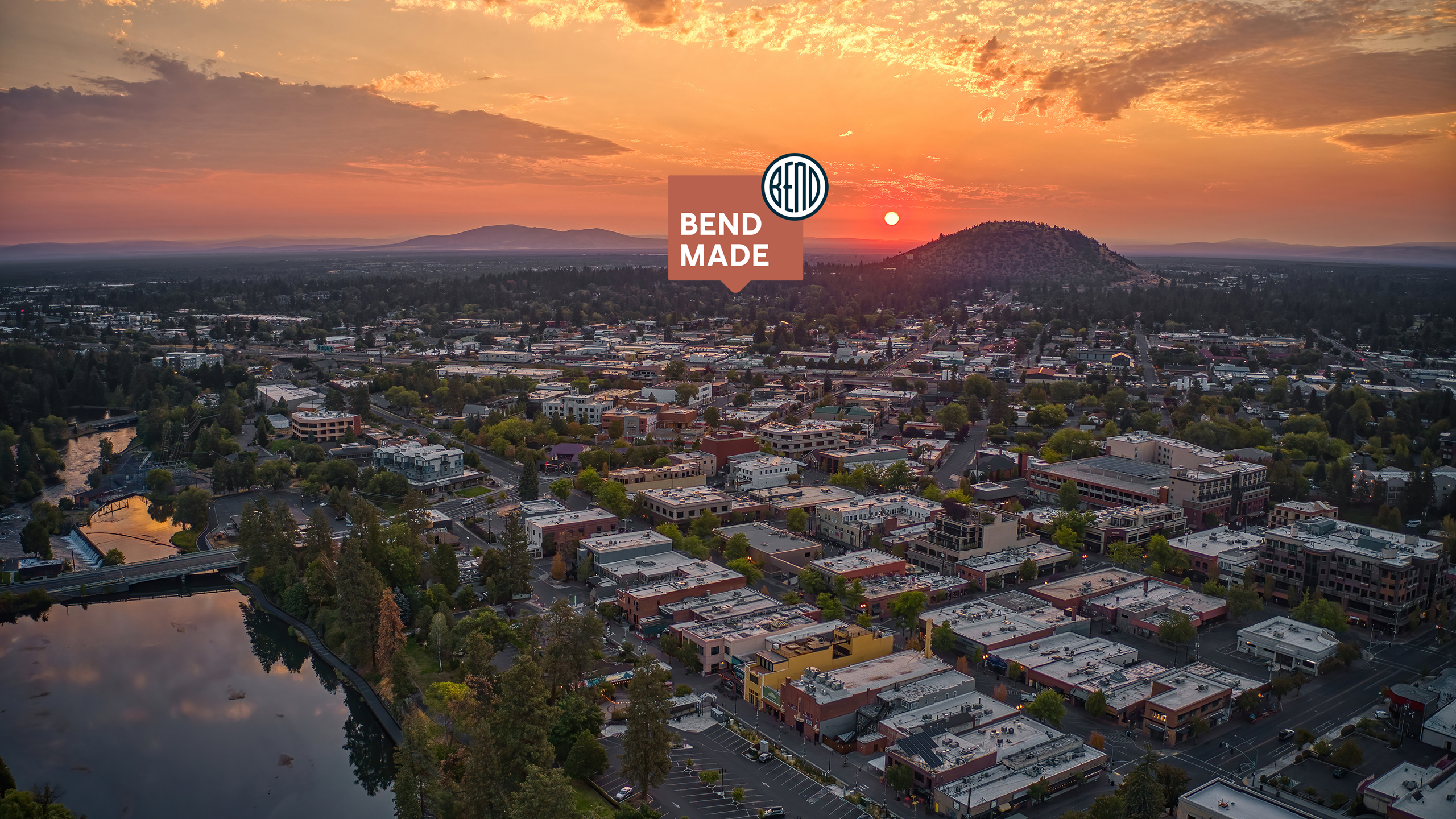 City of Bend overhead drone shot, looking northeast at sunrise.