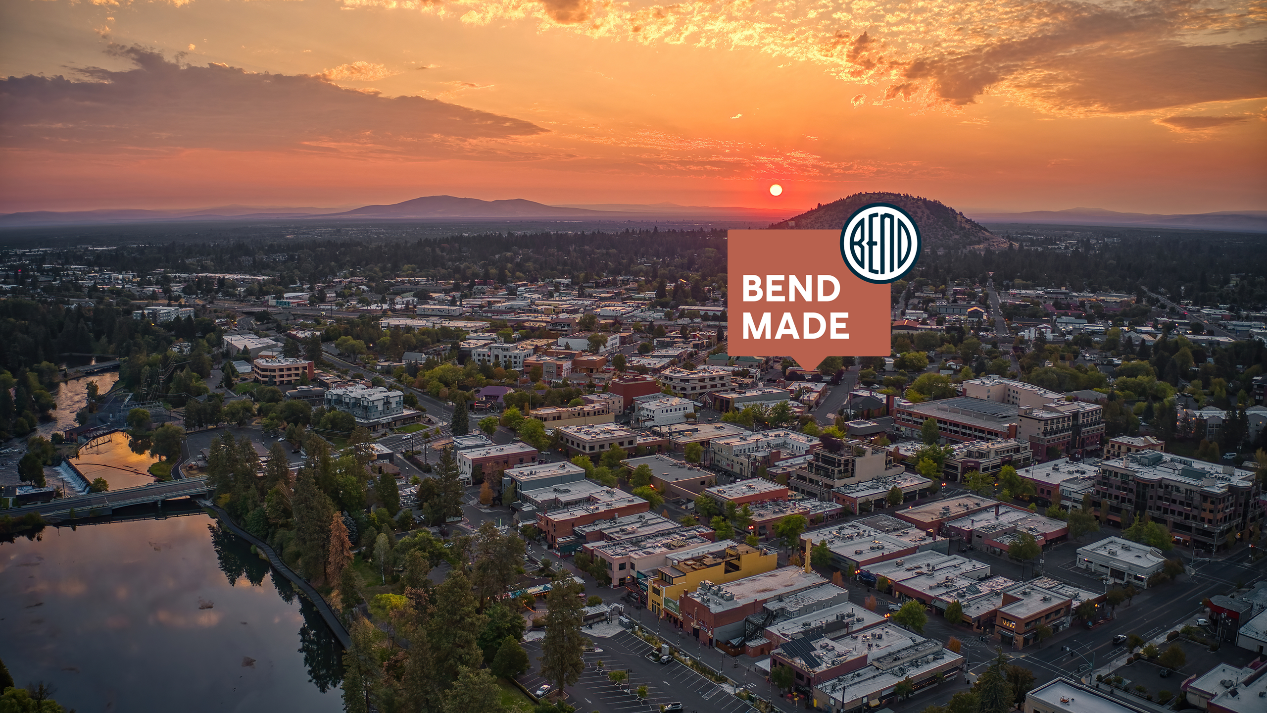 City of Bend overhead drone shot, looking northeast at sunrise.