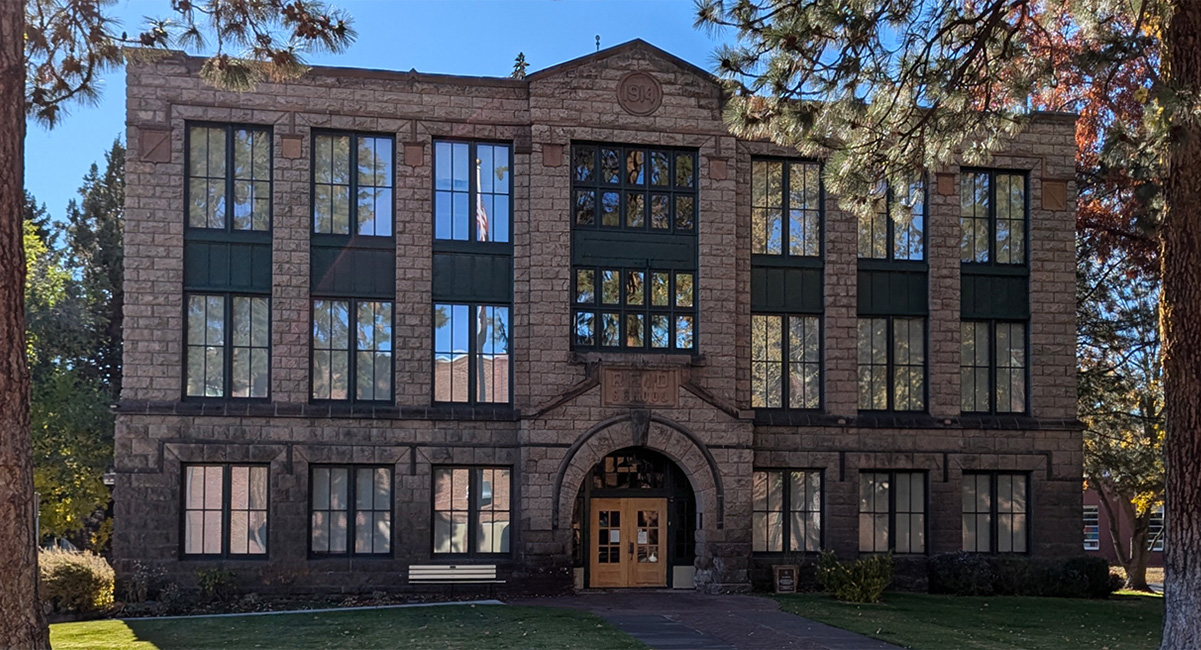 Historical school building made from stone.