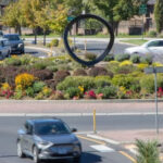Roundabout with vehicles travelling through.